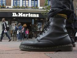 Dr Martens swings to half-year loss as sales slump